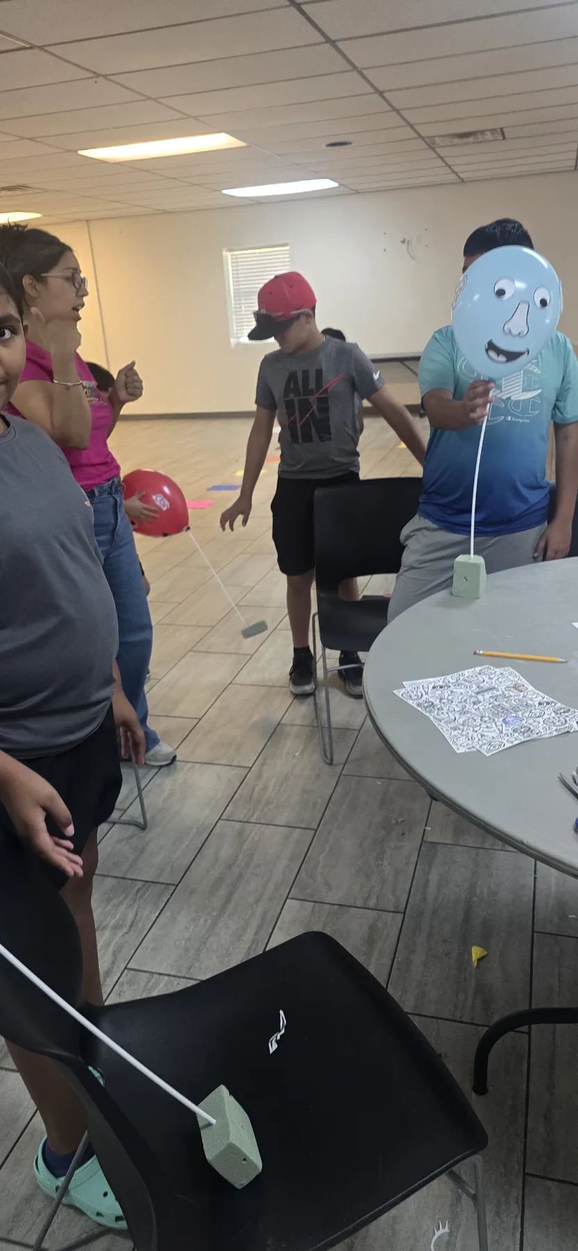 Campers taking part in a friendly indoor Summer Camp game